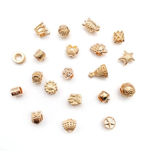 Various KC gold DIY alloy beads featuring crown and turtle designs on white background