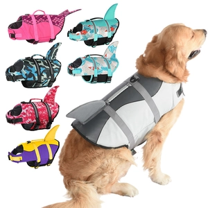 Dog life jacket with shark fin design, featuring adjustable straps and high buoyancy