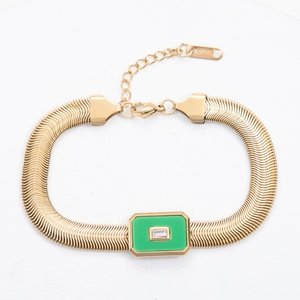 Detail showing 18k gold snake chain with green stone inlay and S.STEEL engraving