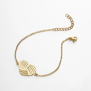 Detail of gold stainless steel bracelet with hollow heart pendant and lobster clasp closure
