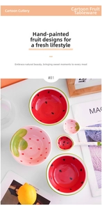 Detail of hand-painted ceramic strawberry and watermelon bowls with matching spoons