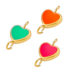 Close-up of heart-shaped enamel charms in green, orange, and pink with gold edges