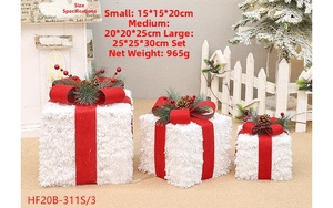 Three-piece set of white flocked Christmas gift boxes with ribbons, pine cones and berries