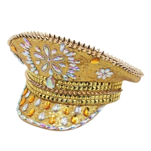 Detailed macro view of a handmade gold sequin captain hat with colorful rhinestones