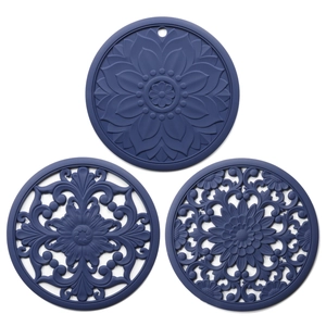 Three blue silicone heat-resistant mats with intricate hollow floral relief patterns