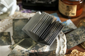 Macro view of vintage junk journal paper layers with antique lace and prop details