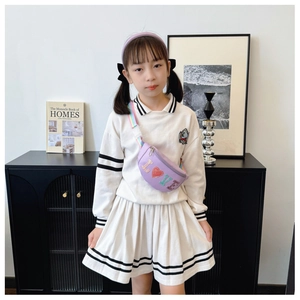 Close-up of kids light purple sequin waist bag with rainbow strap and LOVE letter detail