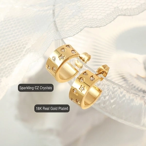 Chic 18K gold plated C-shaped hoop earrings with star engravings and cubic zirconia stones