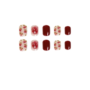 Short round press-on nails featuring rose prints and burgundy glitter ombre design