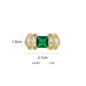 Detail shot of vintage green square gem earrings with gold plating and size measurements