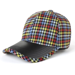 Fashionable multicolor houndstooth baseball cap with black faux leather brim and retro style