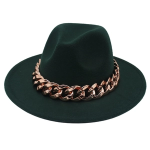 Detail of dark green fedora with thick rose gold acrylic chain on minimalist wool felt hat