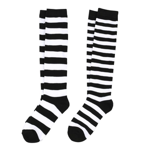 Detail of classic black and white striped knee high socks with soft knitted texture