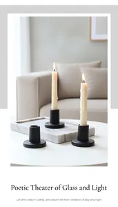 Matte black candle holders on a marble tray for a modern and minimalist home decor set