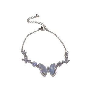 Exquisite silver butterfly bracelet with blue resin wings and shimmering zircon accents