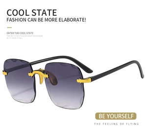 Detail of purple gradient frameless lenses with unique wave-cut edges and gold accents