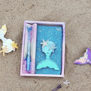Mermaid stationery gift set with blue sequin notebook and fish tail pen in purple box