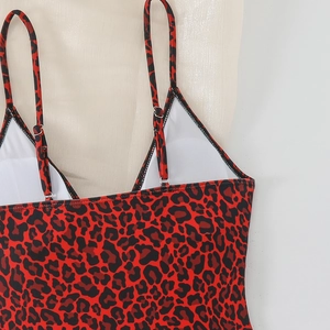 Close-up of leopard print swimsuit with adjustable thin straps and white mesh lining