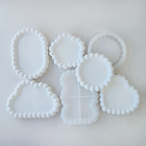 Set of six translucent white silicone molds in varied shapes for DIY resin coaster making
