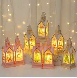 Detail of Christmas lantern with Santa motif and warm LED light for holiday decor