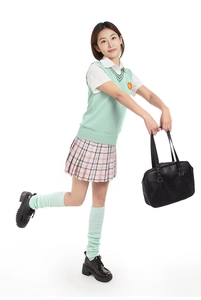 Full view of mint green JK uniform set with loose socks and pleated plaid skirt