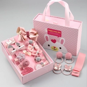 Pink girl's hair accessories gift set including bows and clips in a bunny themed box