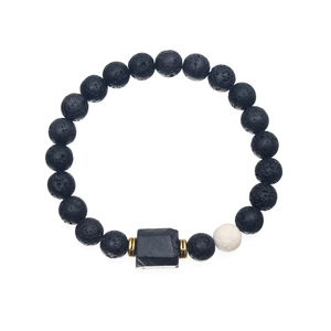 Detailed close-up of volcanic lava stone beads with a square black center and gold spacers