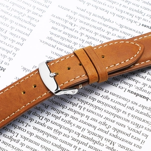 Brown crazy horse leather watch strap with silver buckle and white stitching detail