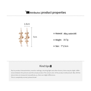 Detailed size specifications for gold petal earrings with pearls and rhinestones