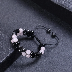 Detail of double-layer beaded bracelet with pink crystal and black obsidian beads