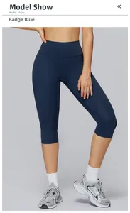 Detail view of high waisted badge blue yoga capri leggings with seamless finish