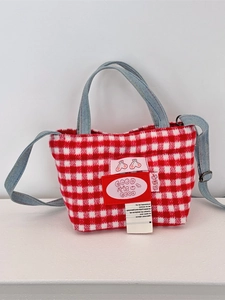 Plaid wool tote bag with denim handles and adjustable strap in red and white colors