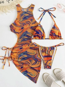 Detailed flat lay of three-piece swirl print bikini set with matching mesh cover-up dress