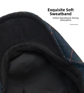 Close-up of wool flat cap interior featuring soft cotton sweatband and blue plaid fabric