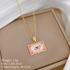 Detail of gold heart pendant necklace with pink enamel and crystal diamonds