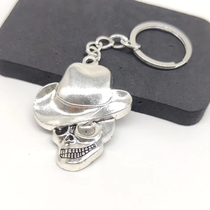 Vintage silver skull pendant keychain with cowboy hat design on metal alloy ring
