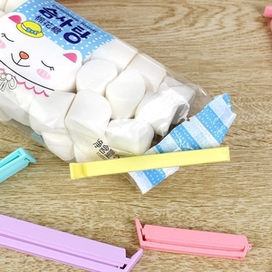 Set of 12 colorful plastic bag sealing clips for snack freshness and moisture protection