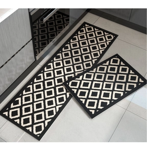 Macro view of woven geometric diamond pattern on black and white kitchen floor mat set