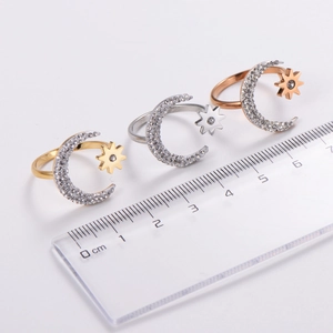 Minimalist celestial rings in gold, silver, and rose gold with moon and star zircon accents
