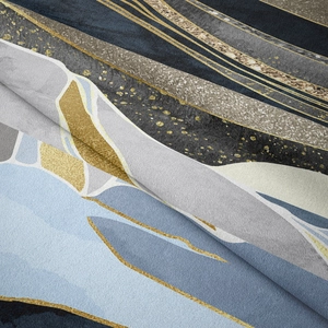 Close-up of abstract blue and gold marble texture on a modern mountains tapestry