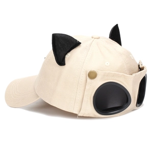 Beige baseball cap with cute cat ears and integrated black aviator goggles on the back