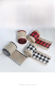 Detail of Christmas burlap ribbons with plaid borders for gift wrapping and holiday decor