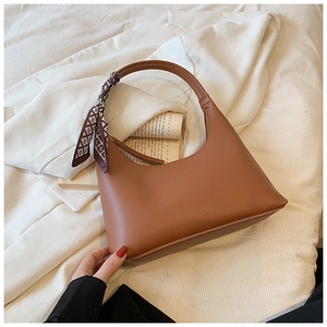 Brown PU leather shoulder bag featuring a decorative silk scarf with geometric patterns