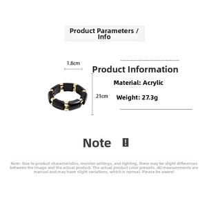 Detail view of black acrylic elastic bracelet with gold bead accents and 21cm size specs