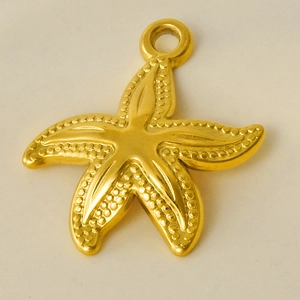 Macro shot of a polished golden starfish pendant with detailed texture and top ring