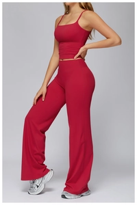 Deep red two-piece yoga set featuring a camisole top and high-waisted flared leggings