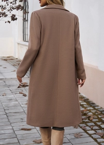 Rear view of long brown wool coat featuring elegant commuter style on a street setting