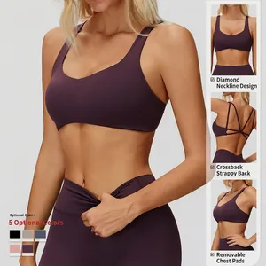 Plum yoga sports bra with crisscross back straps and matching high waist gym leggings