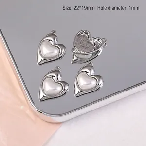 Détail des breloques cœur et nœud en alliage argenté, 22x19mm pour création de bijoux