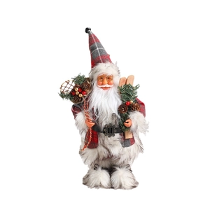 Standing Santa Claus figurine in red plaid outfit with skis and pinecone basket